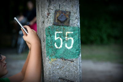 Close-up of hand holding mobile phone