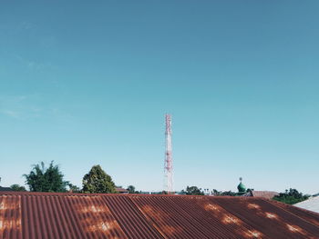 Communications tower against clear blue sky