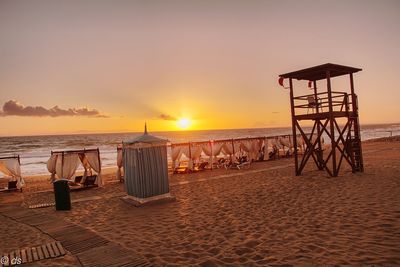 Scenic view of beach at sunset