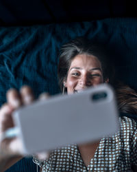 Portrait of man holding mobile phone