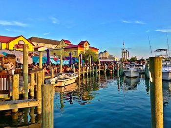 Boats moored at harbor