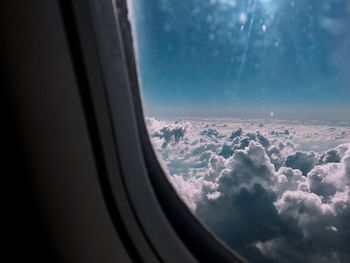 Scenic view of cloudscape seen through airplane window