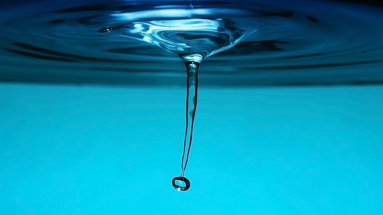 motion, blue, no people, close-up, water, purity, studio shot, freshness, wineglass, indoors, day, dripping