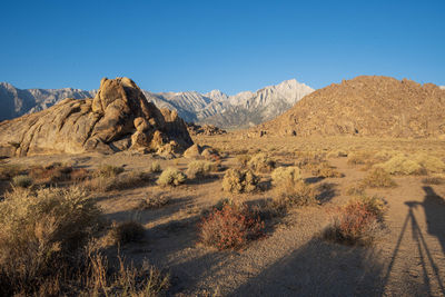 Scenic view of rocky mountains against clear blue sky