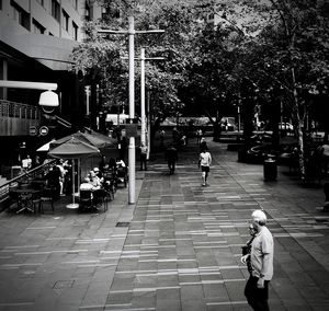 People walking on street in city