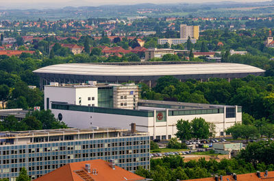 High angle view of buildings and trees in city