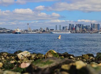 Scenic view of sea and buildings against sky