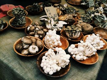 High angle view of various mushrooms for sale at market stall