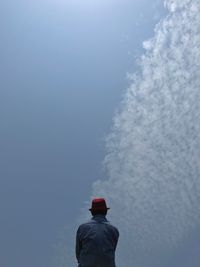 Rear view of man against sky