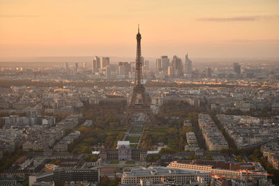 Aerial view of cityscape against sky during sunset