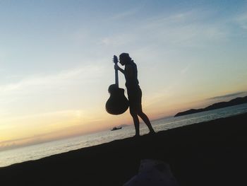 Scenic view of sea at sunset