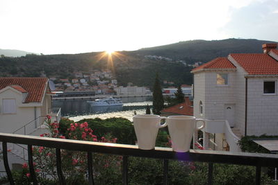 Town by buildings in city against sky