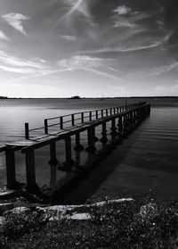 Pier on sea against sky