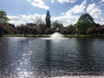 Fountain in park against sky