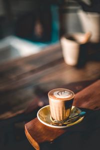 Close-up of coffee served on wooden table