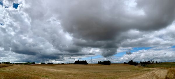 Panoramic view of storm clouds over land