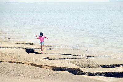 Rear view of woman on beach