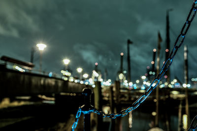 Close-up of illuminated street light at night