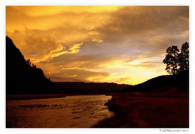 Scenic view of sea and mountains during sunset