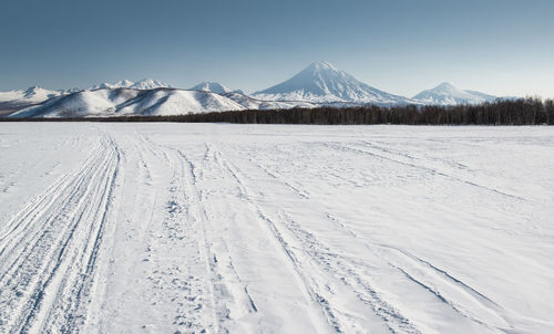 Scenic view of snowcapped mountains against sky