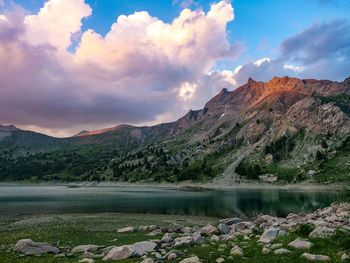 Scenic view of lake and mountains against sky