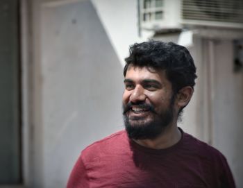 Portrait of smiling young man standing outdoors