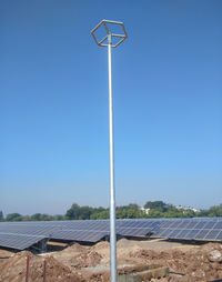 Low angle view of street light against clear blue sky