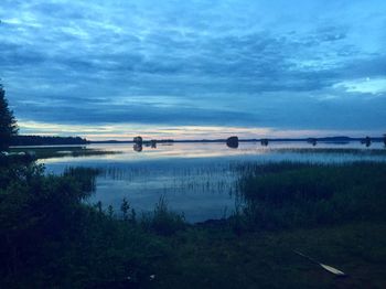 Scenic view of lake against sky during sunset