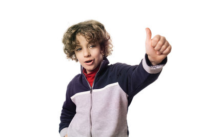 Boy standing against white background