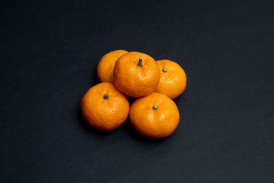 High angle view of orange fruits on table