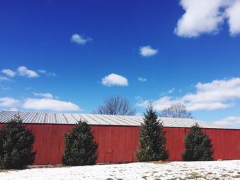 Built structure against blue sky and clouds