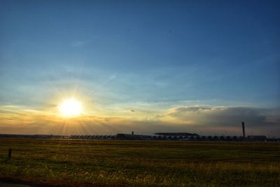 Scenic view of field against sky during sunset