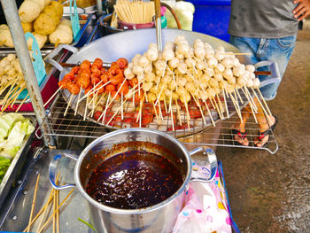 High angle view of person holding food at market stall
