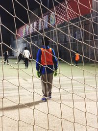 People playing soccer on field