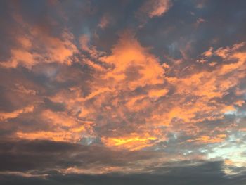 Low angle view of dramatic sky during sunset