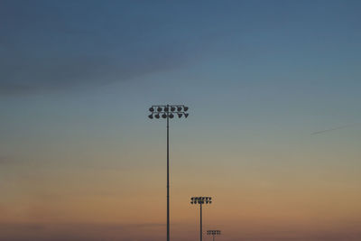 Information sign against sky during sunset