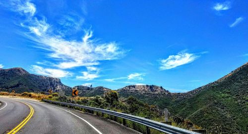 Country road leading towards mountains