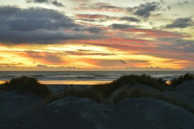 Scenic view of sea against cloudy sky