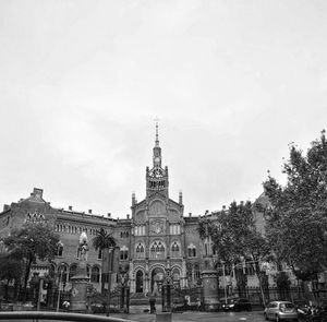 View of buildings in city against sky
