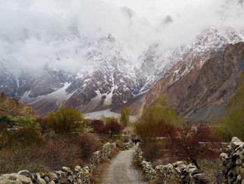 Panoramic view of snowcapped mountains against sky