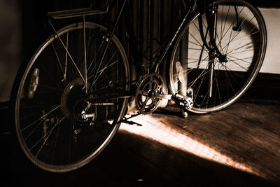 Close-up of bicycle wheel at night