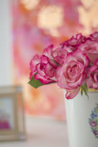 Close-up of pink rose flower vase