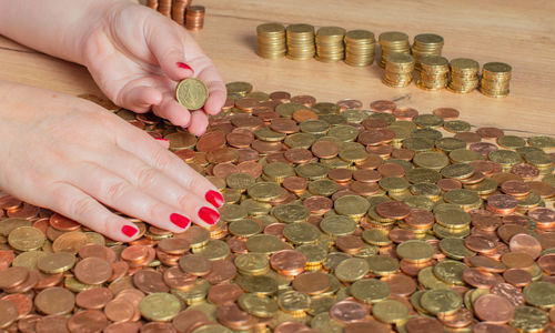 Cropped hand of woman holding pills