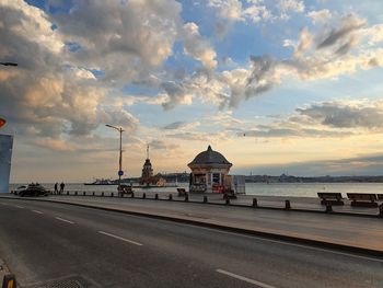 Road by sea against sky in city