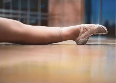 Low section of ballet dancer on floor