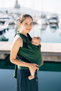 Happy mother with baby in water