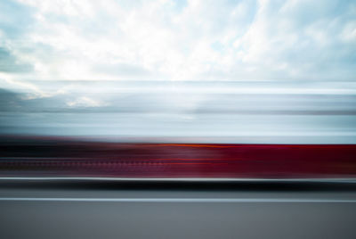 Blurred motion of sea seen through train window