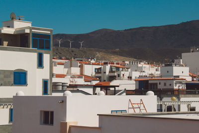 Houses against clear blue sky