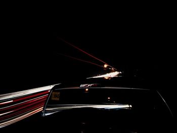 Light trails against sky at night