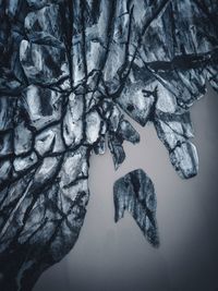 Close-up of glacier by lake during winter with a drone